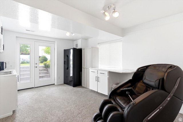 5321 South 3100th Street West Roy, UT 84067 - Photo 46 of 64 Light-filled space featuring French doors, white cabinetry, a built-in countertop, and track lighting