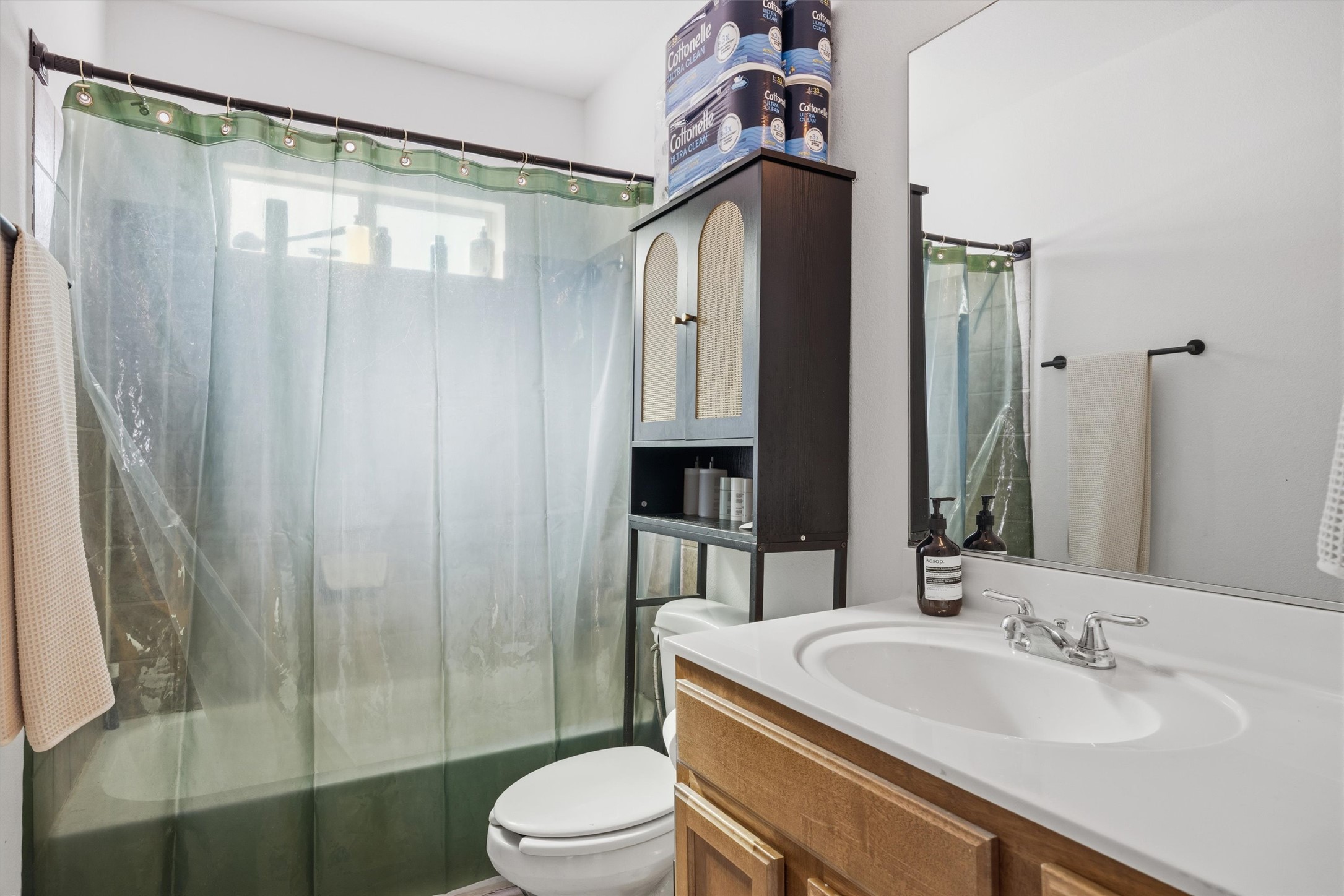 3015 Castro Street Austin, TX 78702 - Photo 18 of 40 A well-lit bathroom provides a functional vanity and tub, offering everyday convenience.