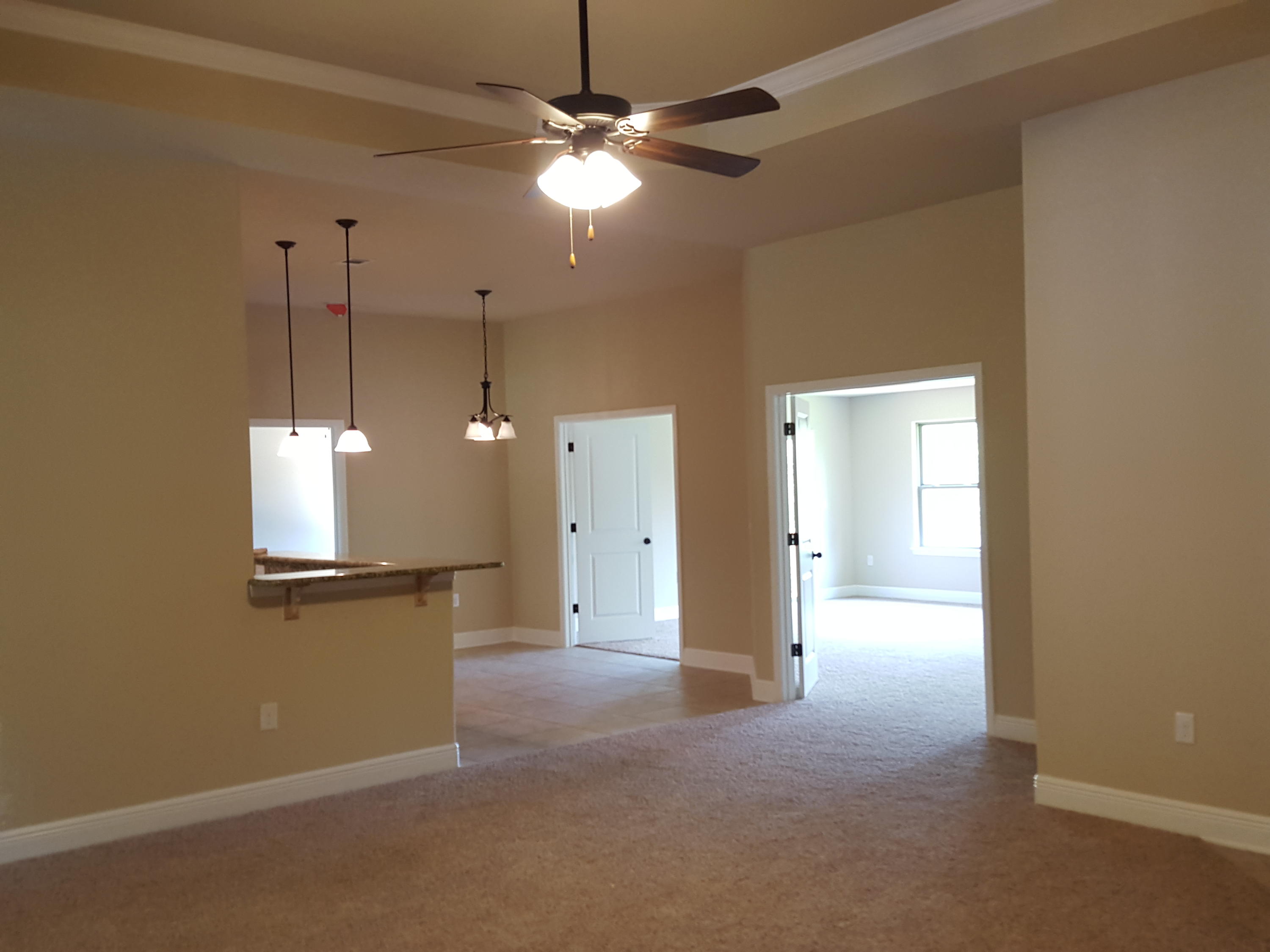 515 Vale Loop Crestview, FL 32536 - Photo 14 of 28 a view of a room with a ceiling fan and a window
