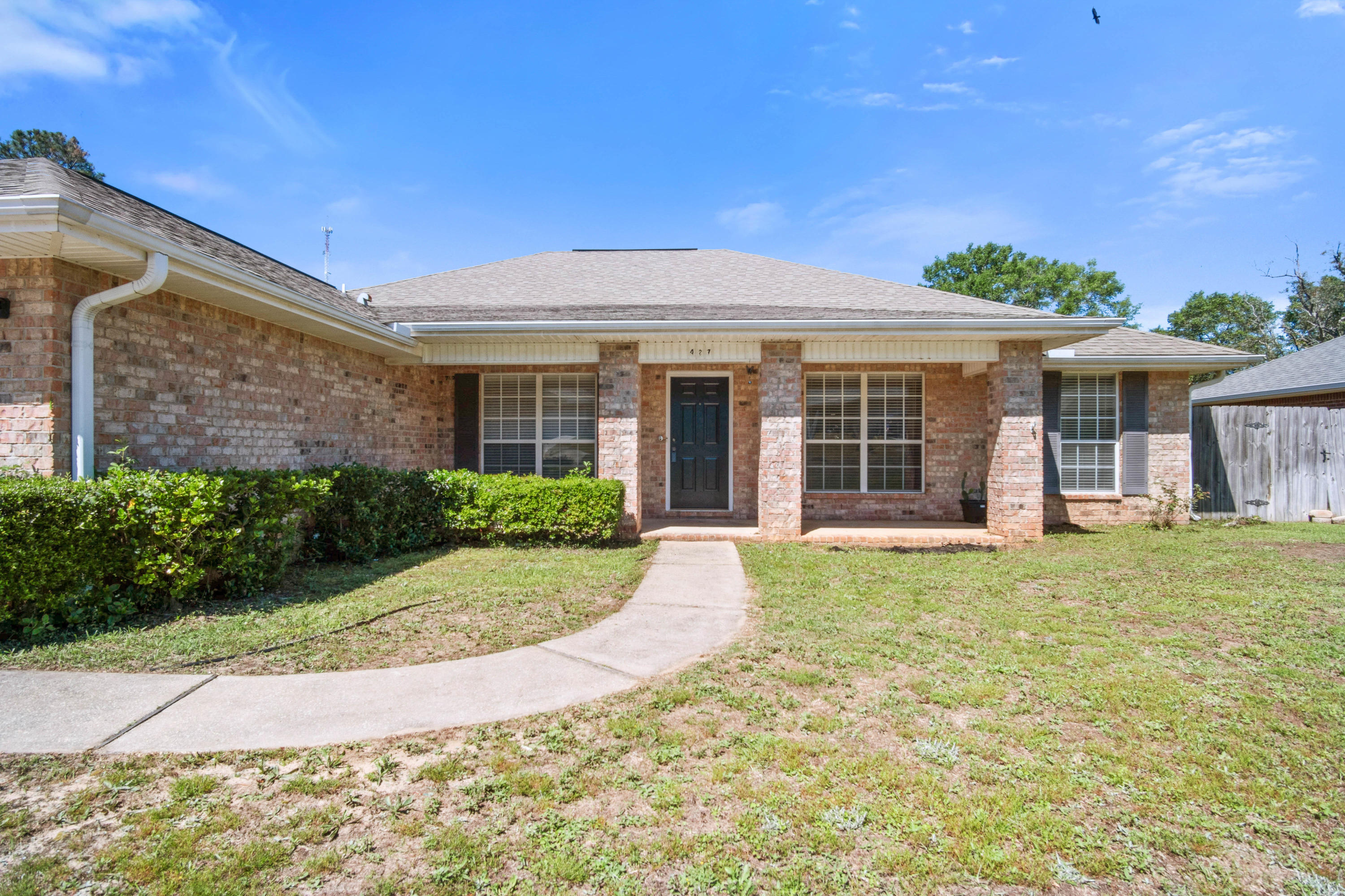 a front view of a house with a yard