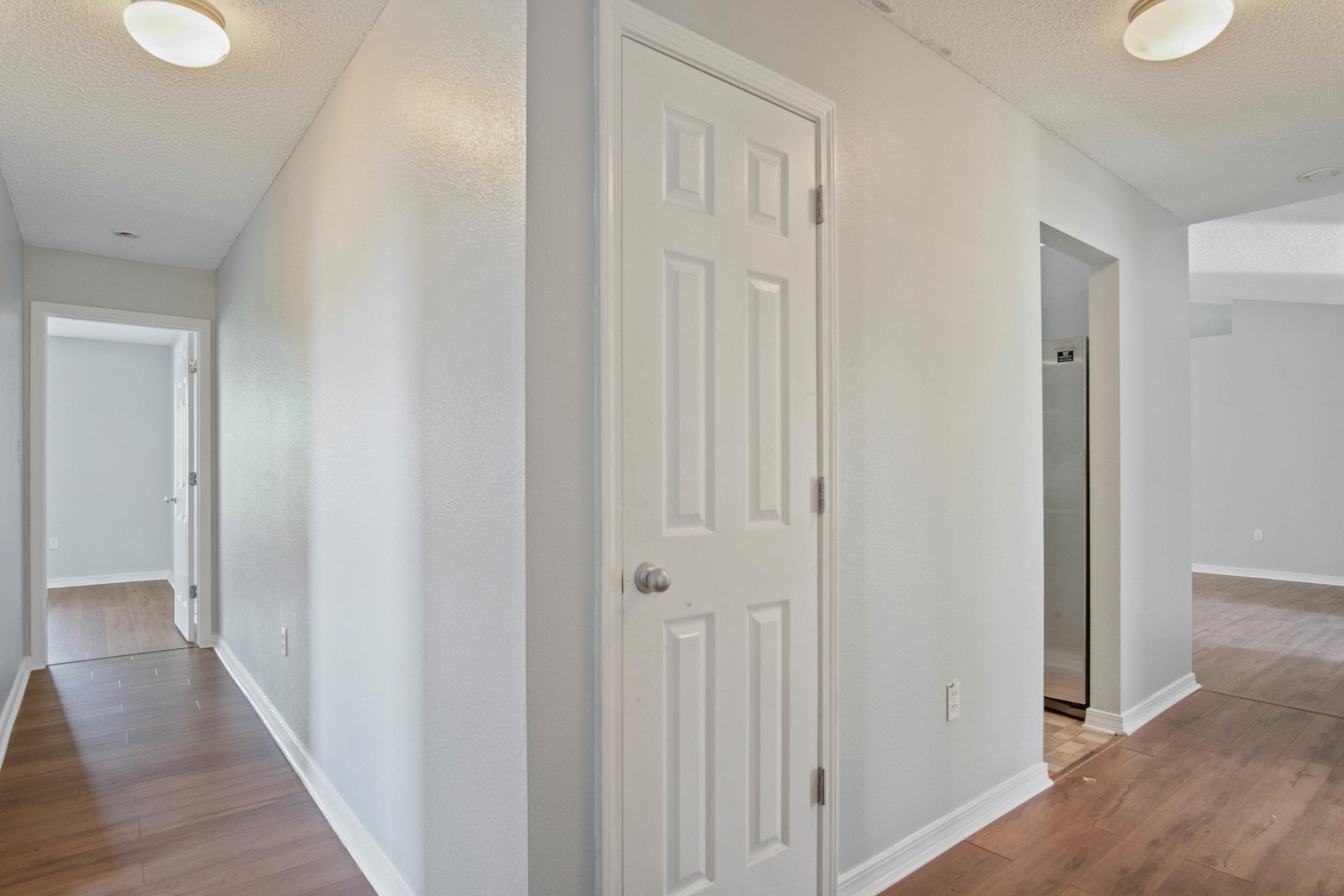 427 Triton Street Crestview, FL 32536 - Photo 16 of 32 a view of a hallway with wooden floor
