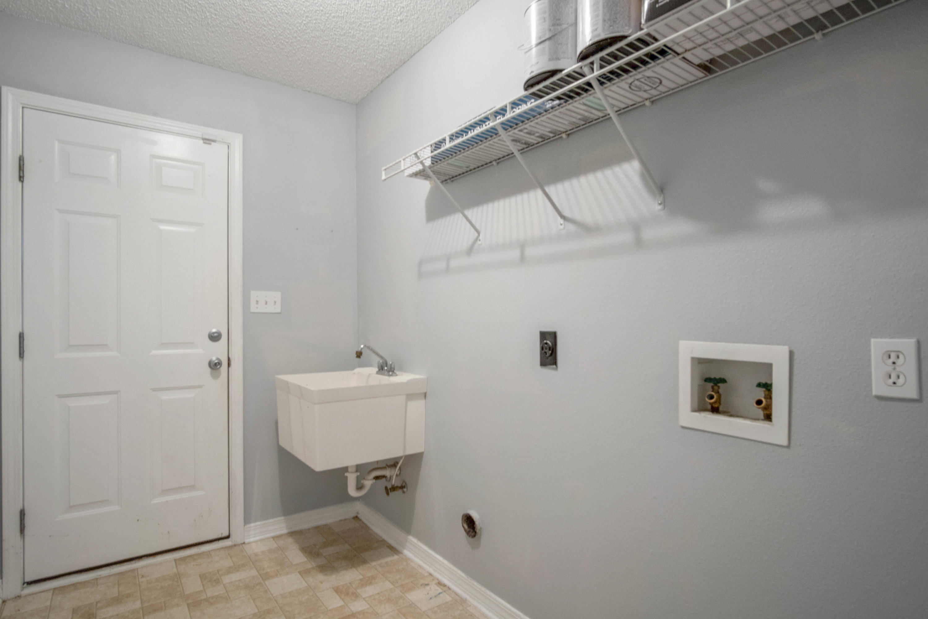 427 Triton Street Crestview, FL 32536 - Photo 17 of 32 a bathroom with a sink and a mirror
