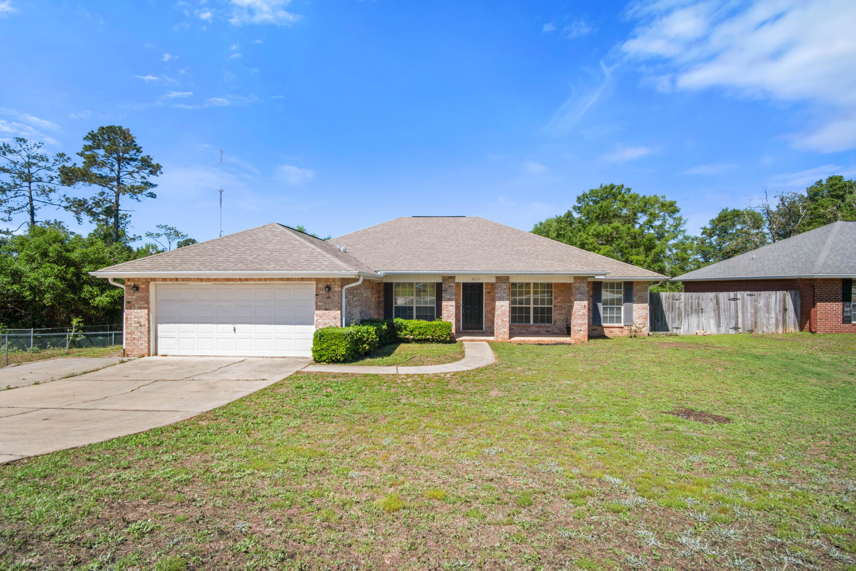 427 Triton Street Crestview, FL 32536 - Photo 3 of 32 a front view of a house with a garden