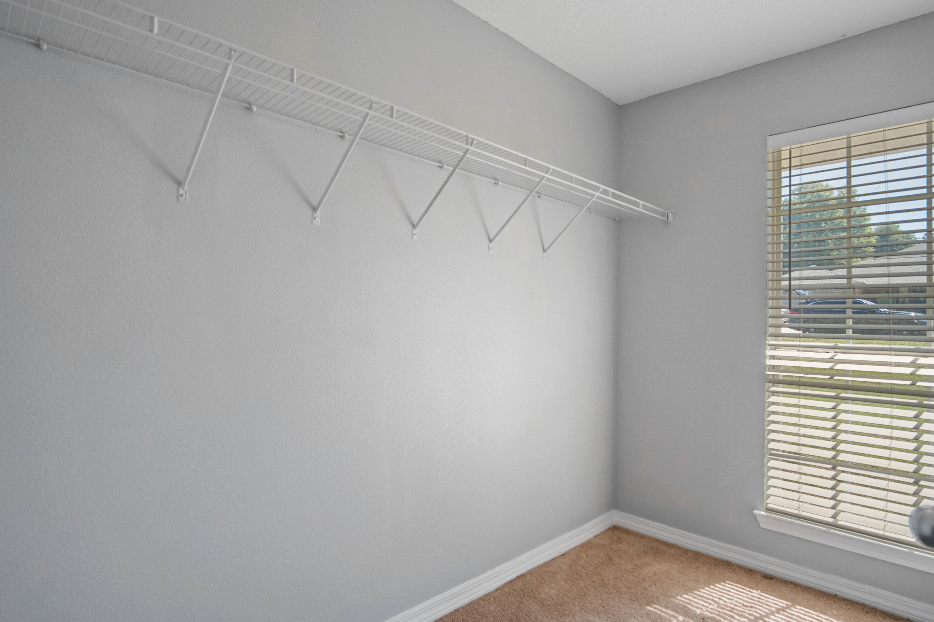 427 Triton Street Crestview, FL 32536 - Photo 31 of 32 a view of a room that has a window and cabinets