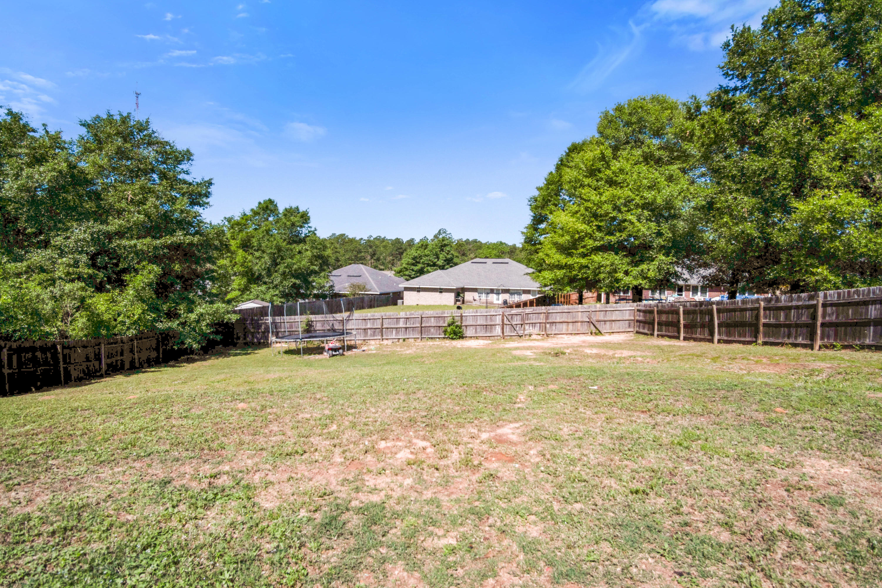 427 Triton Street Crestview, FL 32536 - Photo 32 of 32 a view of a house with a yard and swimming pool