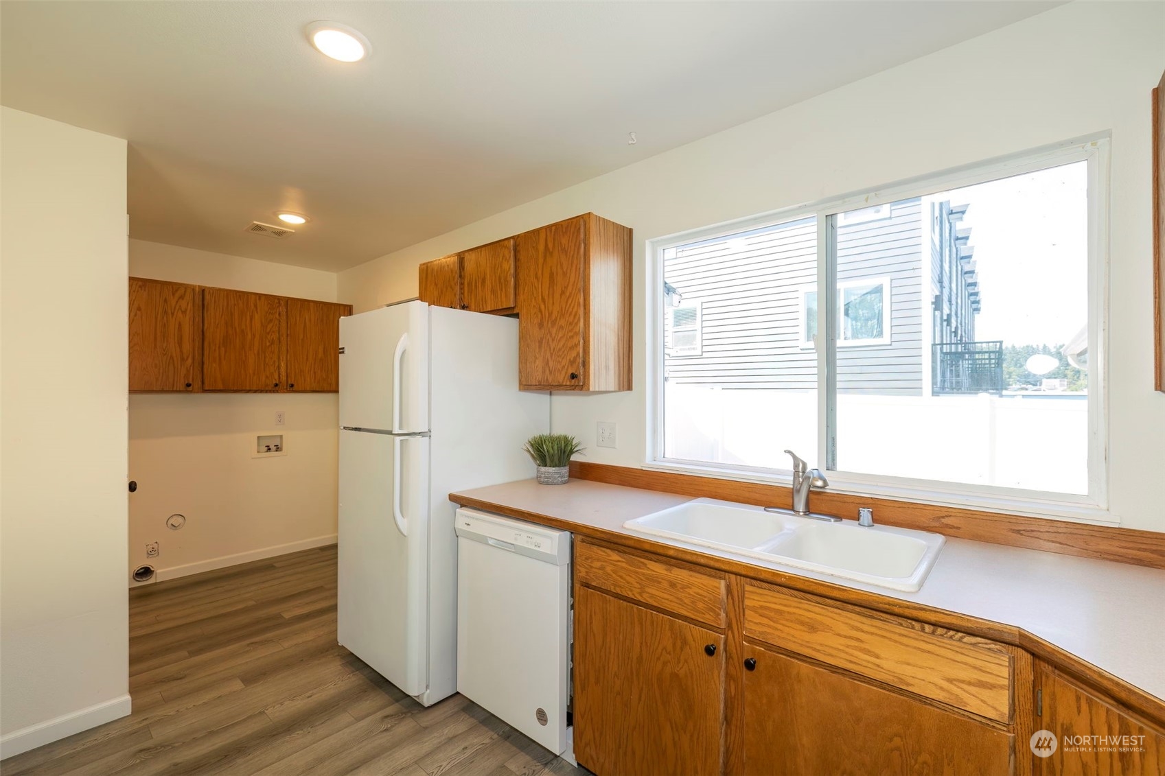 3982 Broadmoor Loop Bremerton, WA 98310 - Photo 19 of 40 a kitchen with a sink and refrigerator