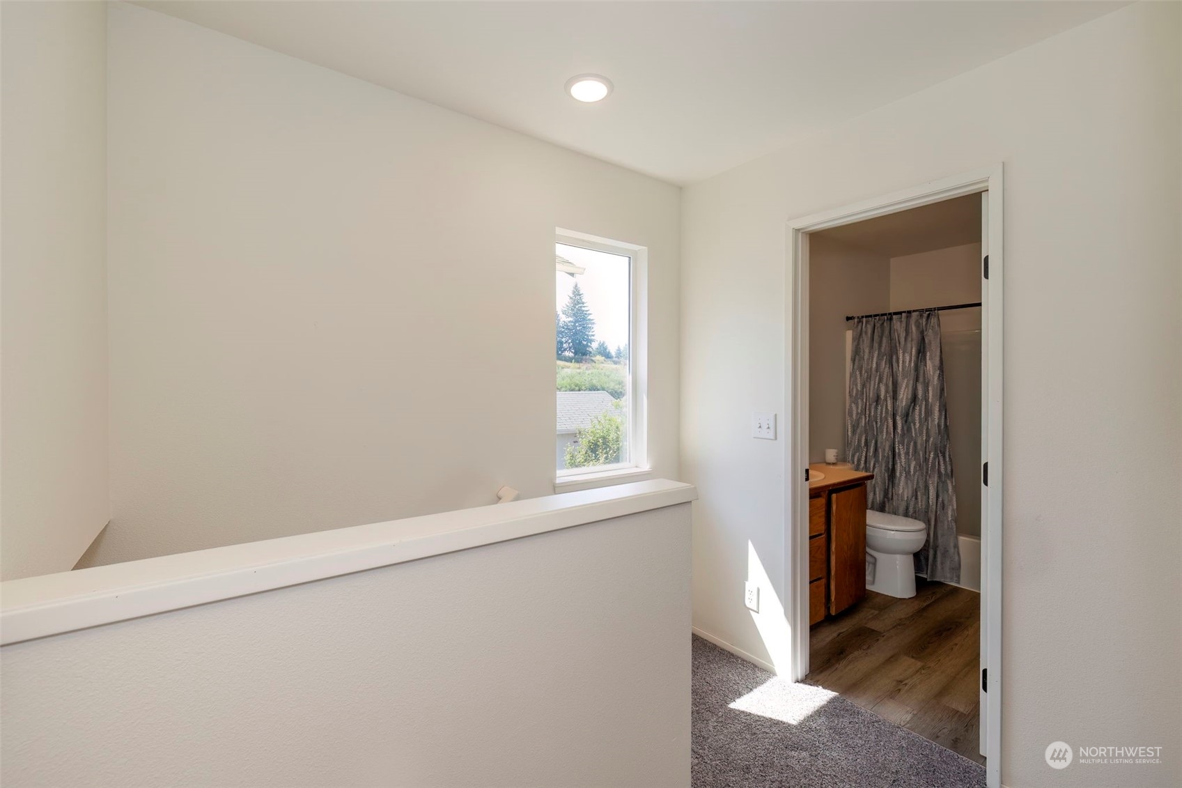 3982 Broadmoor Loop Bremerton, WA 98310 - Photo 22 of 40 an empty room with a window and a bathroom