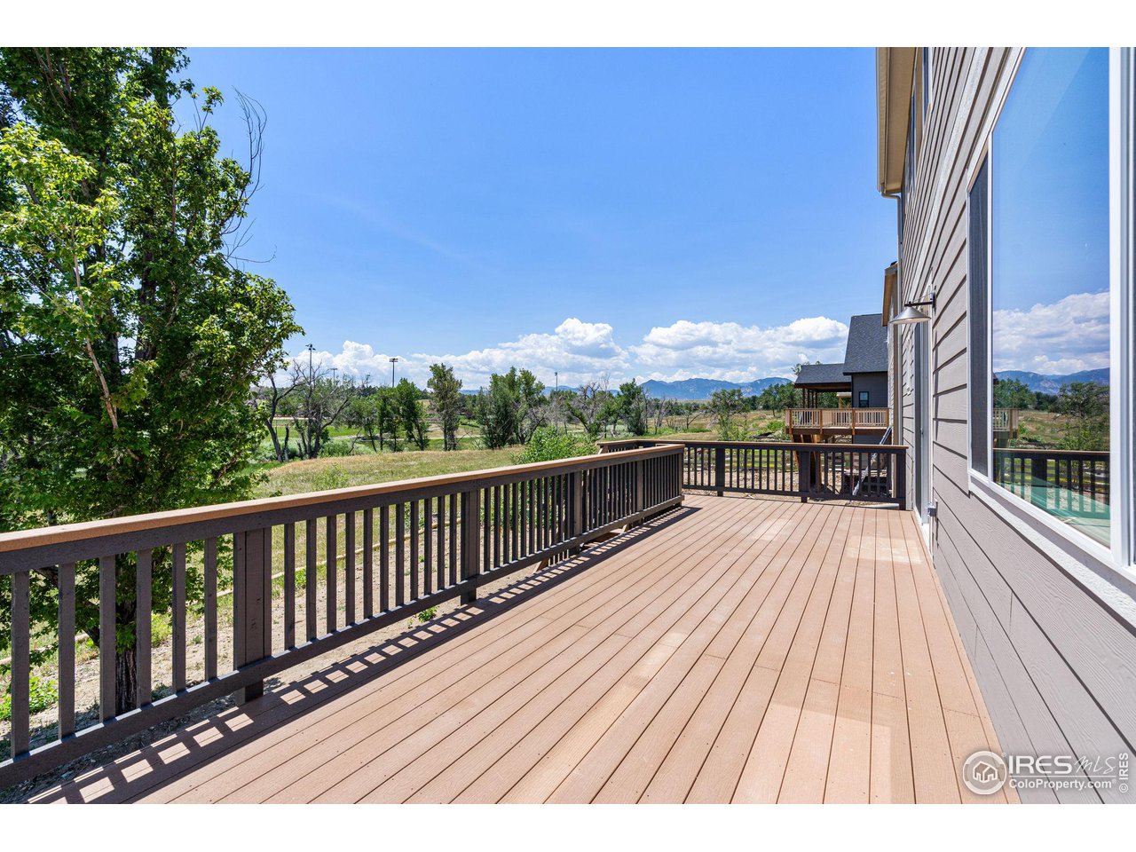 1382 Eldorado Drive Superior, CO 80027 - Photo 11 of 40 a view of balcony with wooden floor and outdoor seating