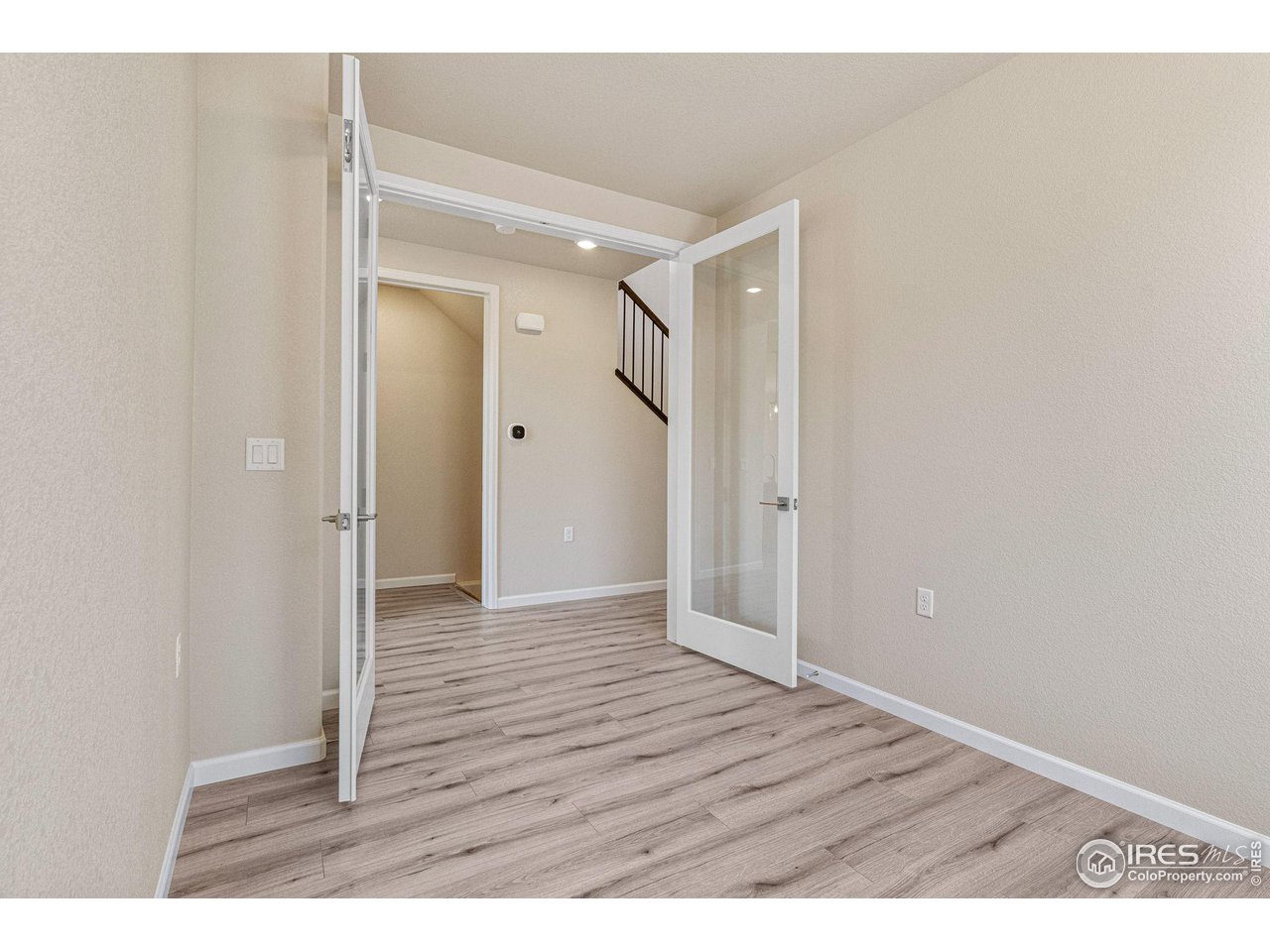 1382 Eldorado Drive Superior, CO 80027 - Photo 14 of 40 a view of an empty room with wooden floor