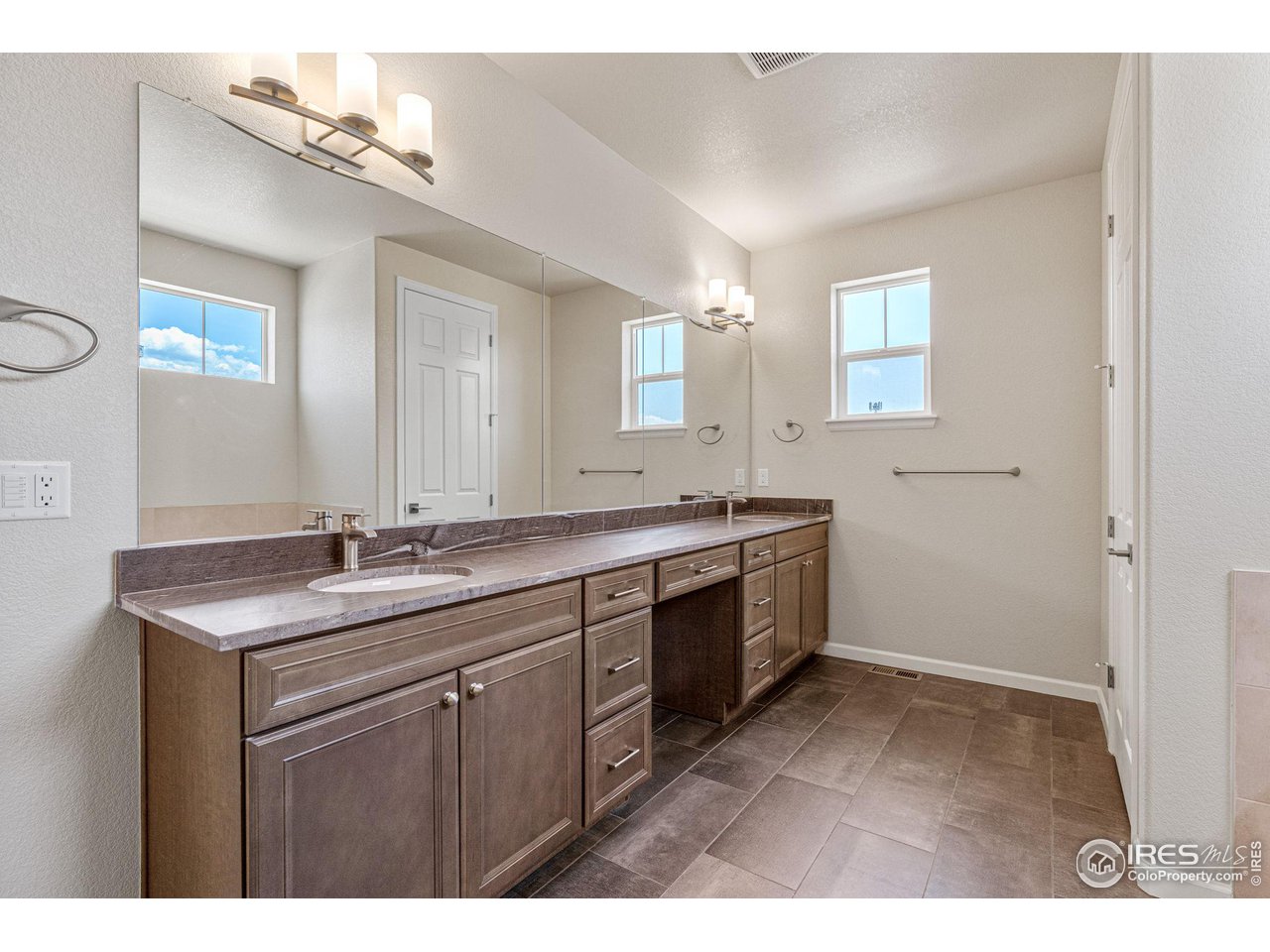 1382 Eldorado Drive Superior, CO 80027 - Photo 23 of 40 a bathroom with a sink and a mirror