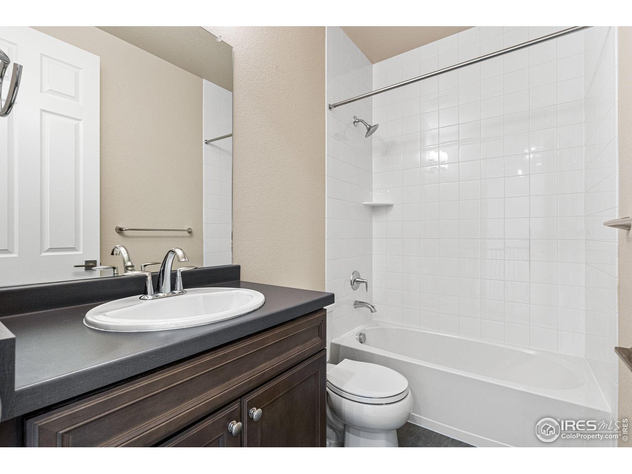 1382 Eldorado Drive Superior, CO 80027 - Photo 32 of 40 a bathroom with a sink a toilet a mirror and shower