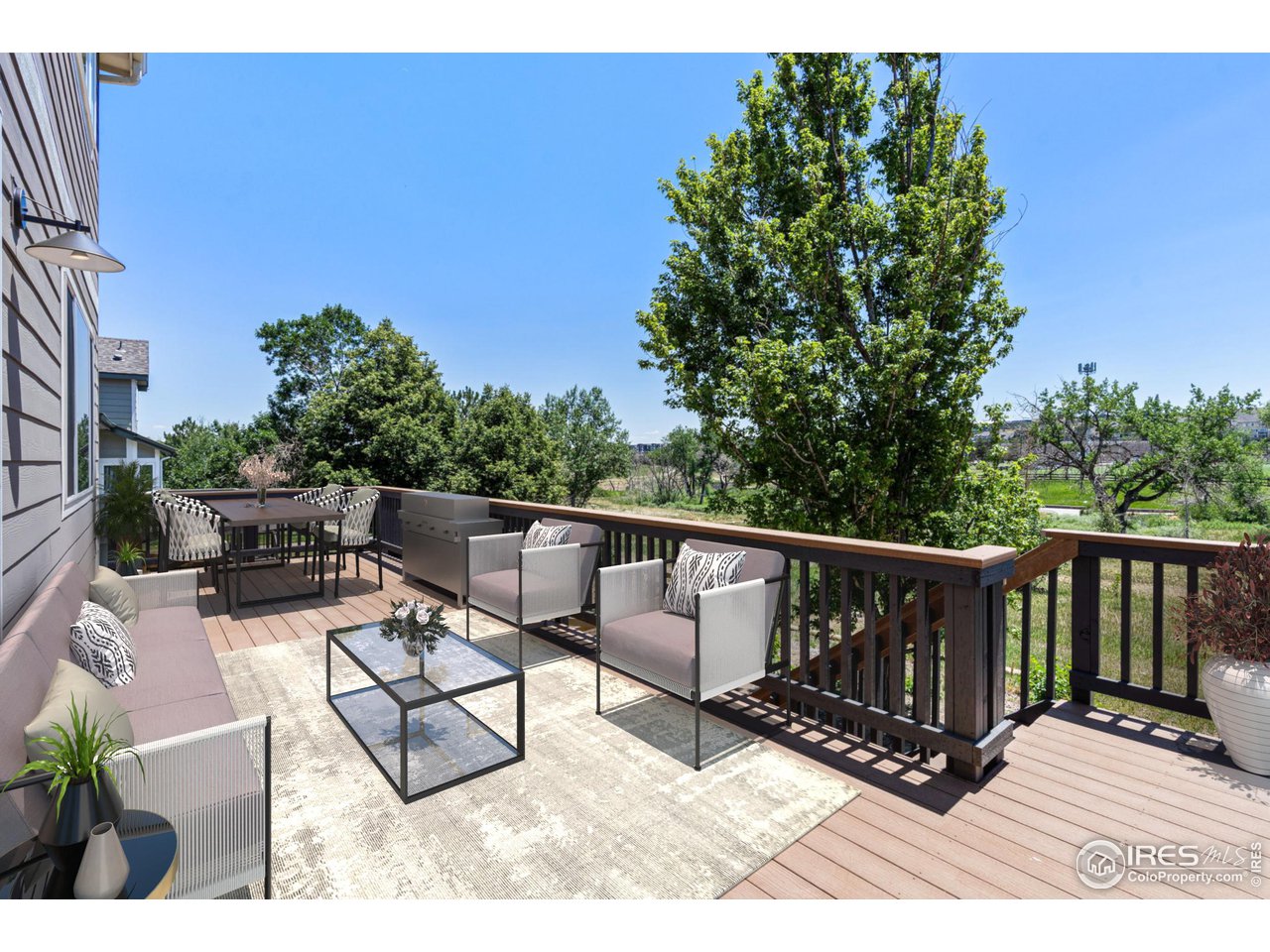 1382 Eldorado Drive Superior, CO 80027 - Photo 10 of 40 a view of balcony with wooden floor and outdoor seating