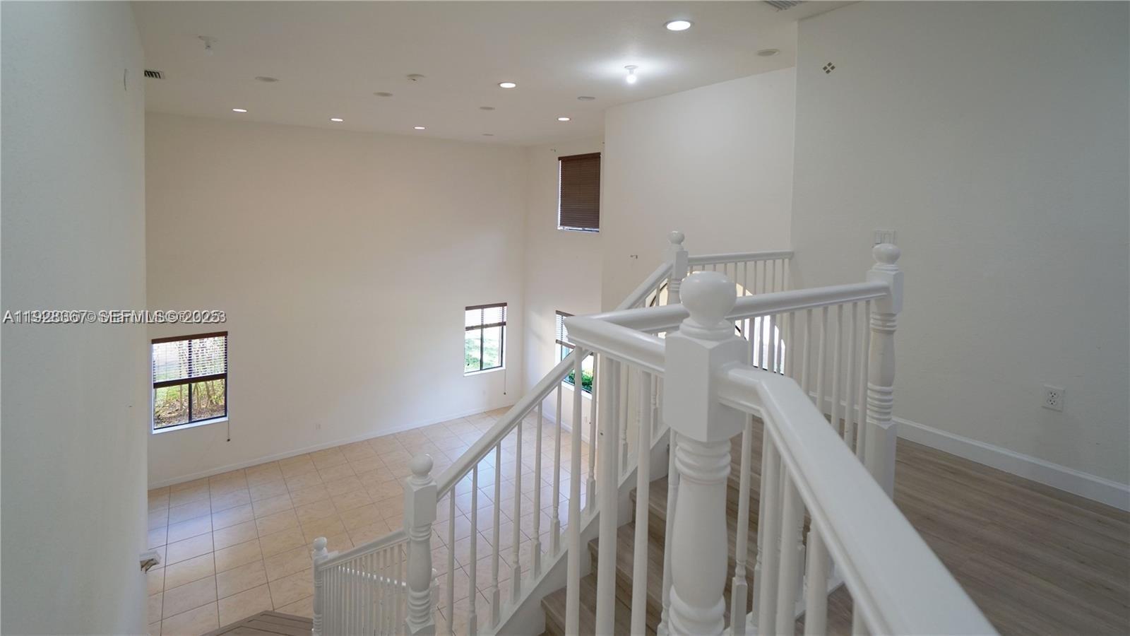 7507 Southwest 189th Street, Unit 7507 Cutler Bay, FL 33157 - Photo 15 of 28 a view of entryway and hall with wooden floor
