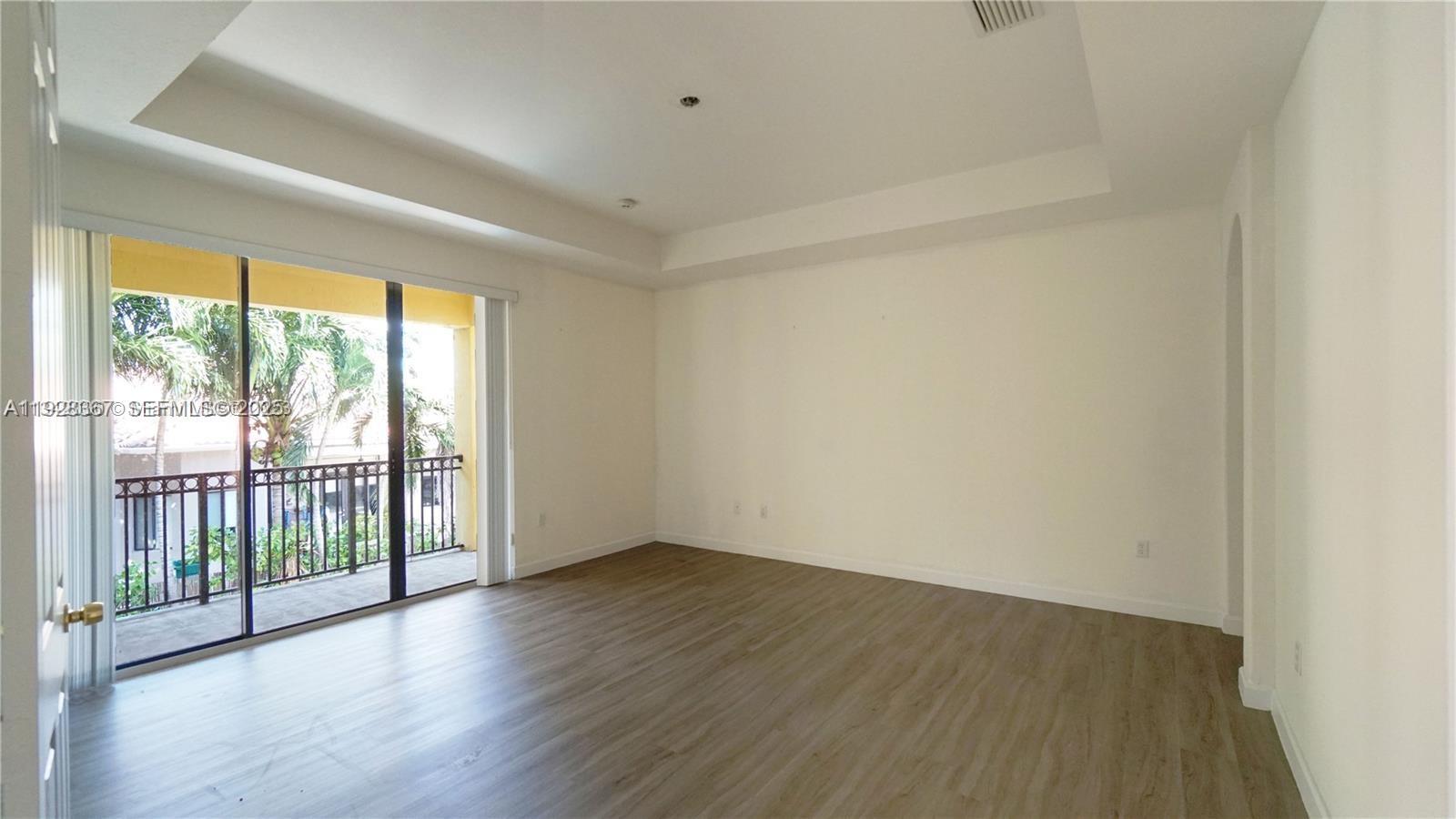 7507 Southwest 189th Street, Unit 7507 Cutler Bay, FL 33157 - Photo 23 of 28 wooden floor in an empty room