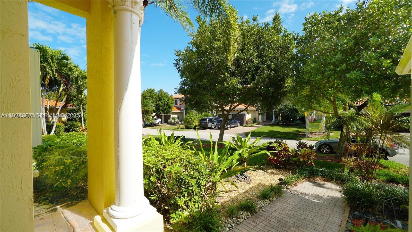 7507 Southwest 189th Street, Unit 7507 Cutler Bay, FL 33157 - Photo 4 of 28 a view of a garden with plants