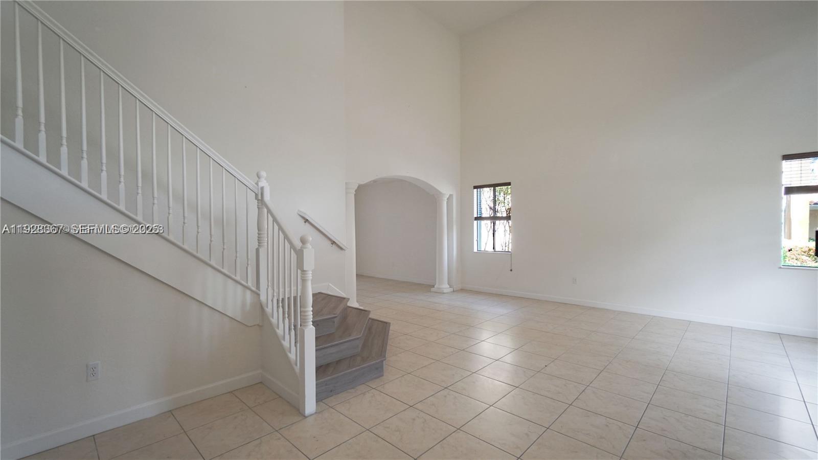 7507 Southwest 189th Street, Unit 7507 Cutler Bay, FL 33157 - Photo 6 of 28 a view of entryway and hall with wooden floor