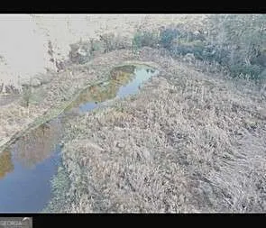 a view of a backyard of the house