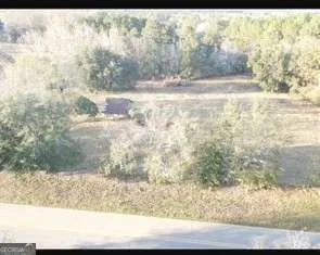 a view of backyard of a house