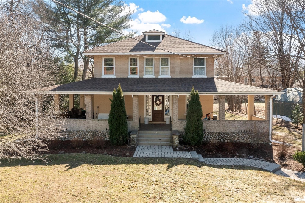 20 Shattuck Street Littleton, MA 01460 - Photo 1 of 41 a front view of a house with a yard and garage