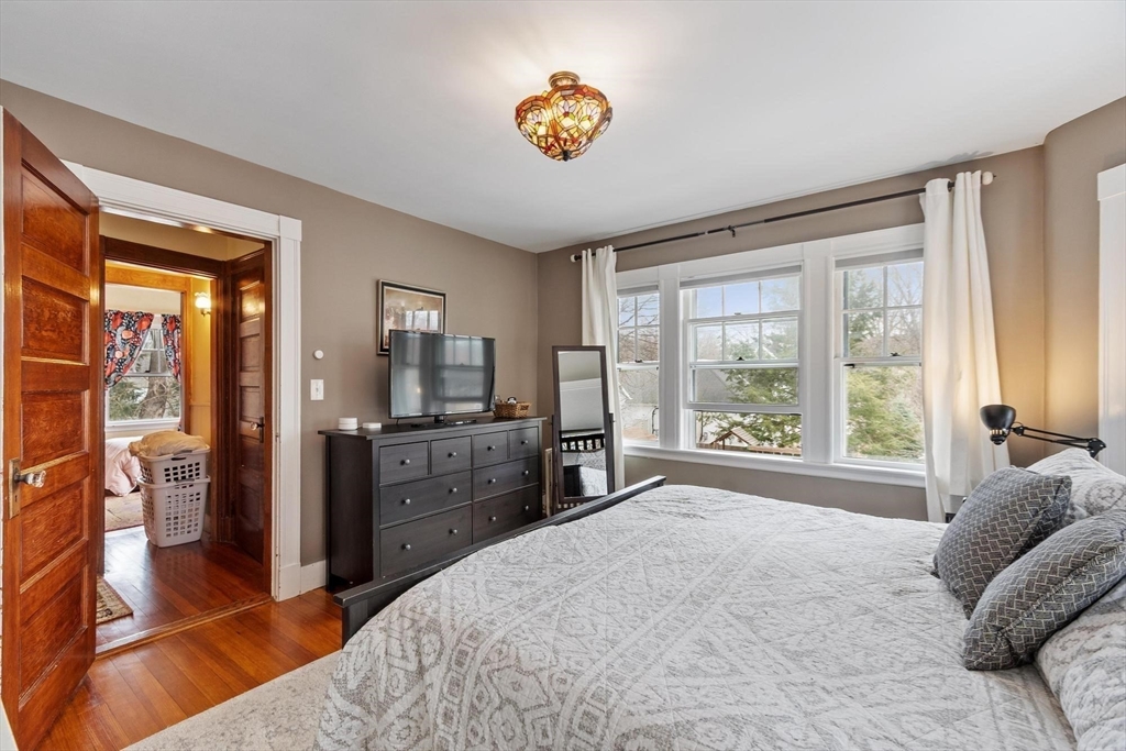20 Shattuck Street Littleton, MA 01460 - Photo 28 of 41 a spacious bedroom with a large bed and a window