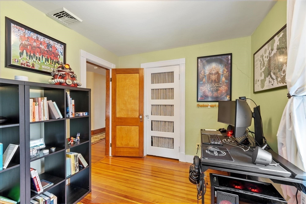 20 Shattuck Street Littleton, MA 01460 - Photo 35 of 41 a bedroom with furniture and a flat screen tv