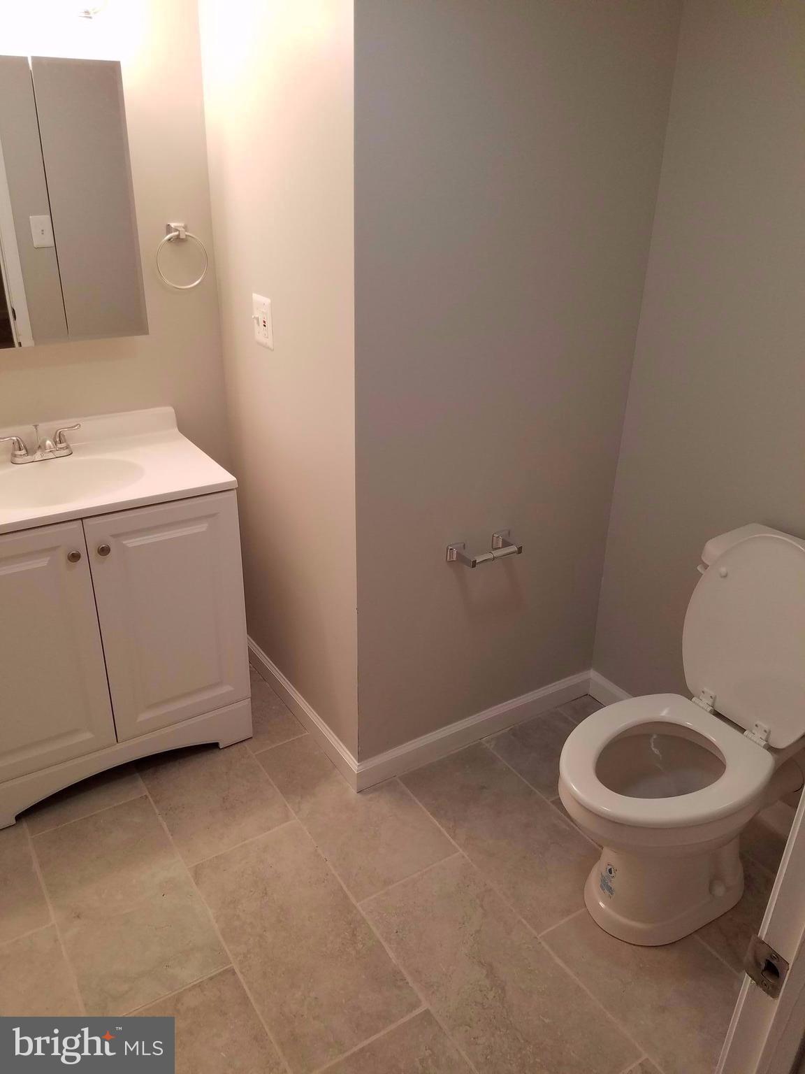 1335 Ava Road Severn, MD 21144 - Photo 13 of 13 a bathroom with a toilet and a sink