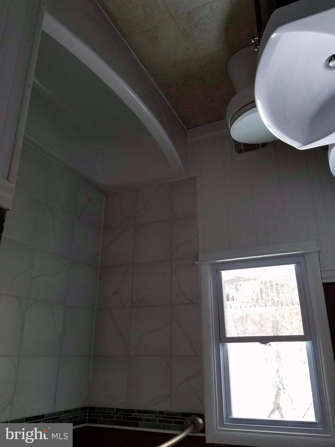 1335 Ava Road Severn, MD 21144 - Photo 10 of 13 a bathroom with a sink and a mirror