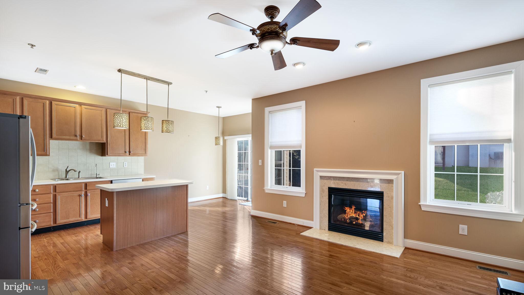 2372 Dorchester Street West, Unit W Furlong, PA 18925 - Photo 14 of 41 a living room with stainless steel appliances granite countertop a fireplace a flat screen tv and a fireplace