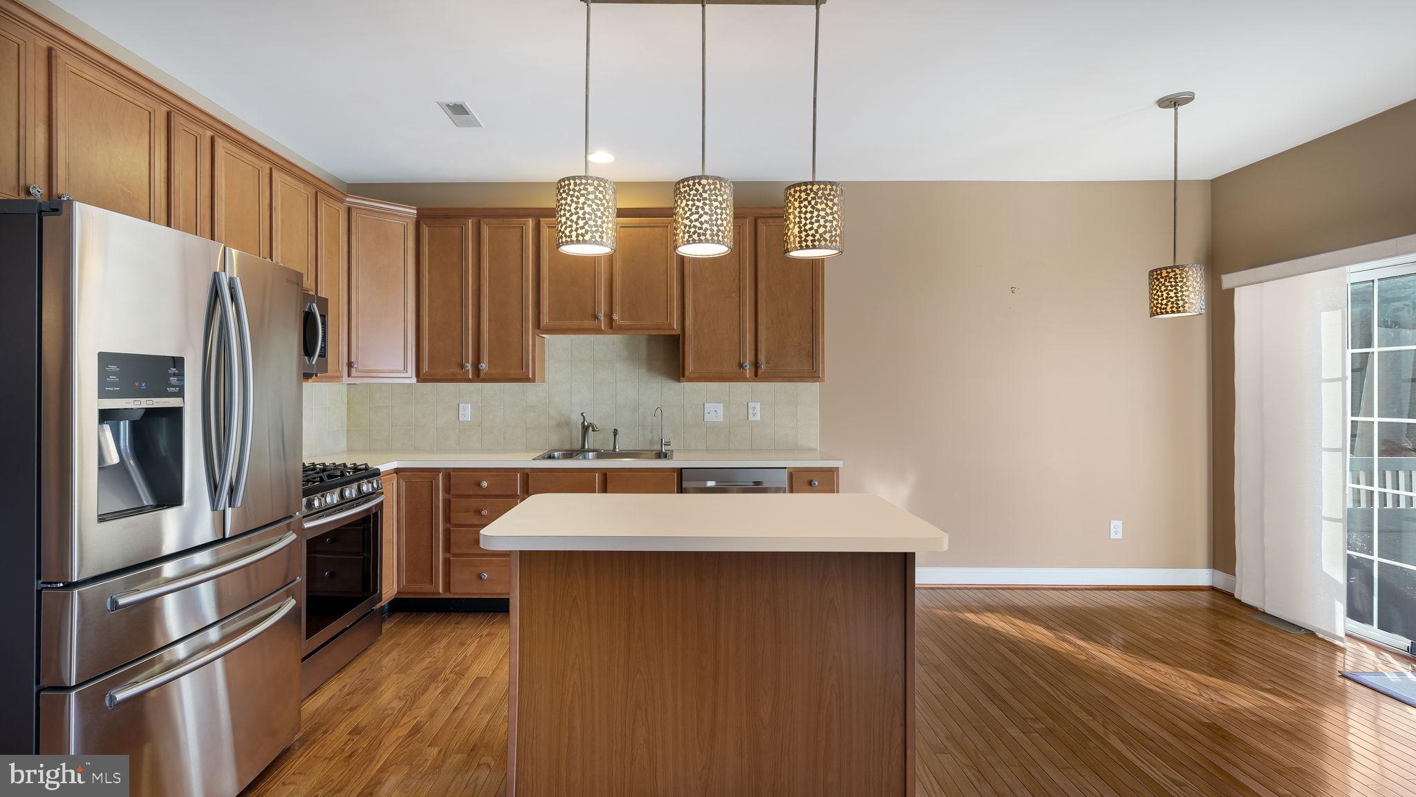 2372 Dorchester Street West, Unit W Furlong, PA 18925 - Photo 16 of 41 a kitchen with stainless steel appliances a refrigerator sink and stove