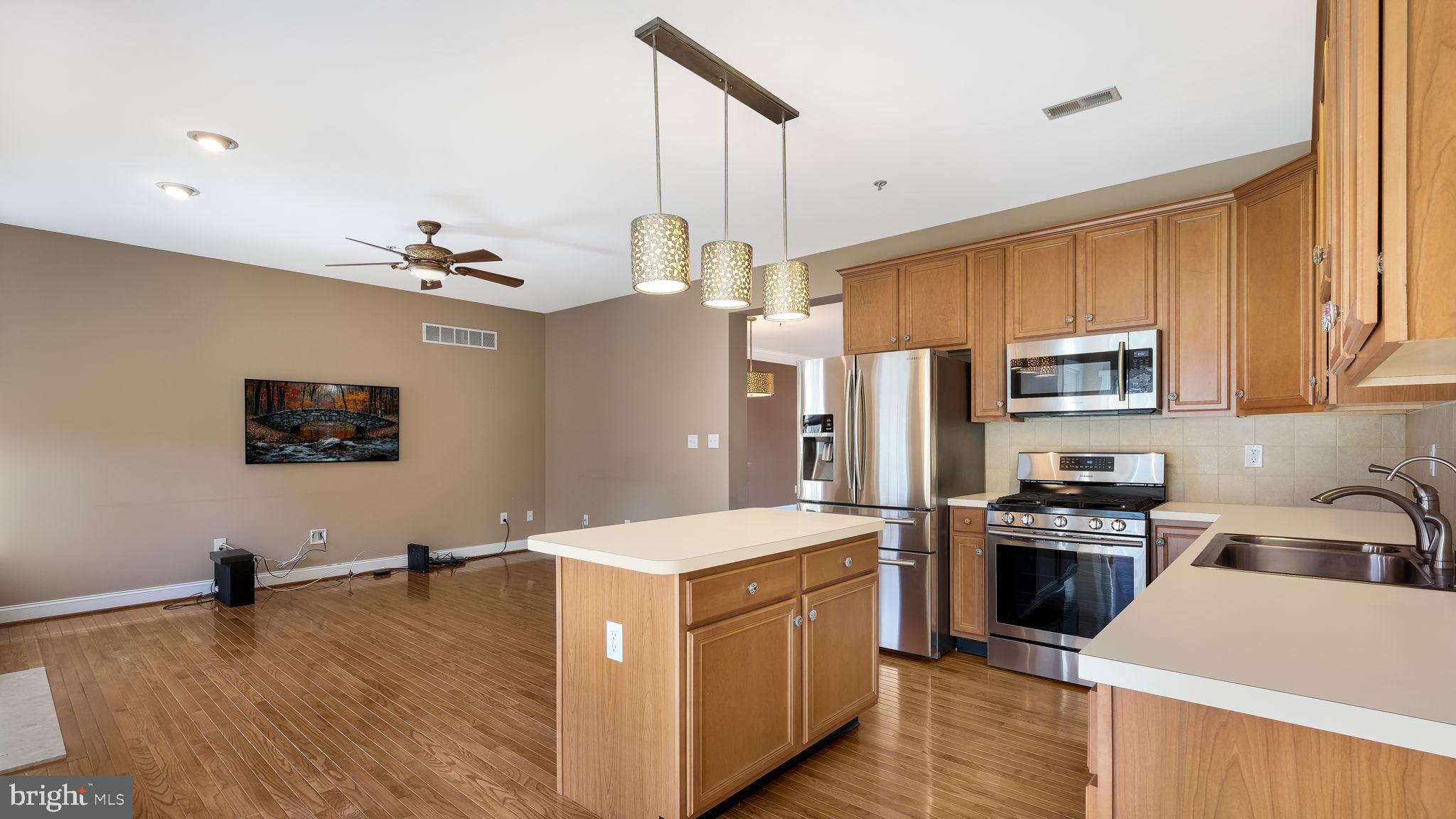 2372 Dorchester Street West, Unit W Furlong, PA 18925 - Photo 19 of 41 a kitchen with a refrigerator and a sink