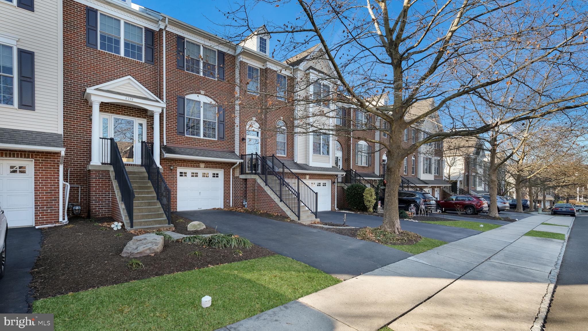 2372 Dorchester Street West, Unit W Furlong, PA 18925 - Photo 2 of 41 a front view of a building with a garden