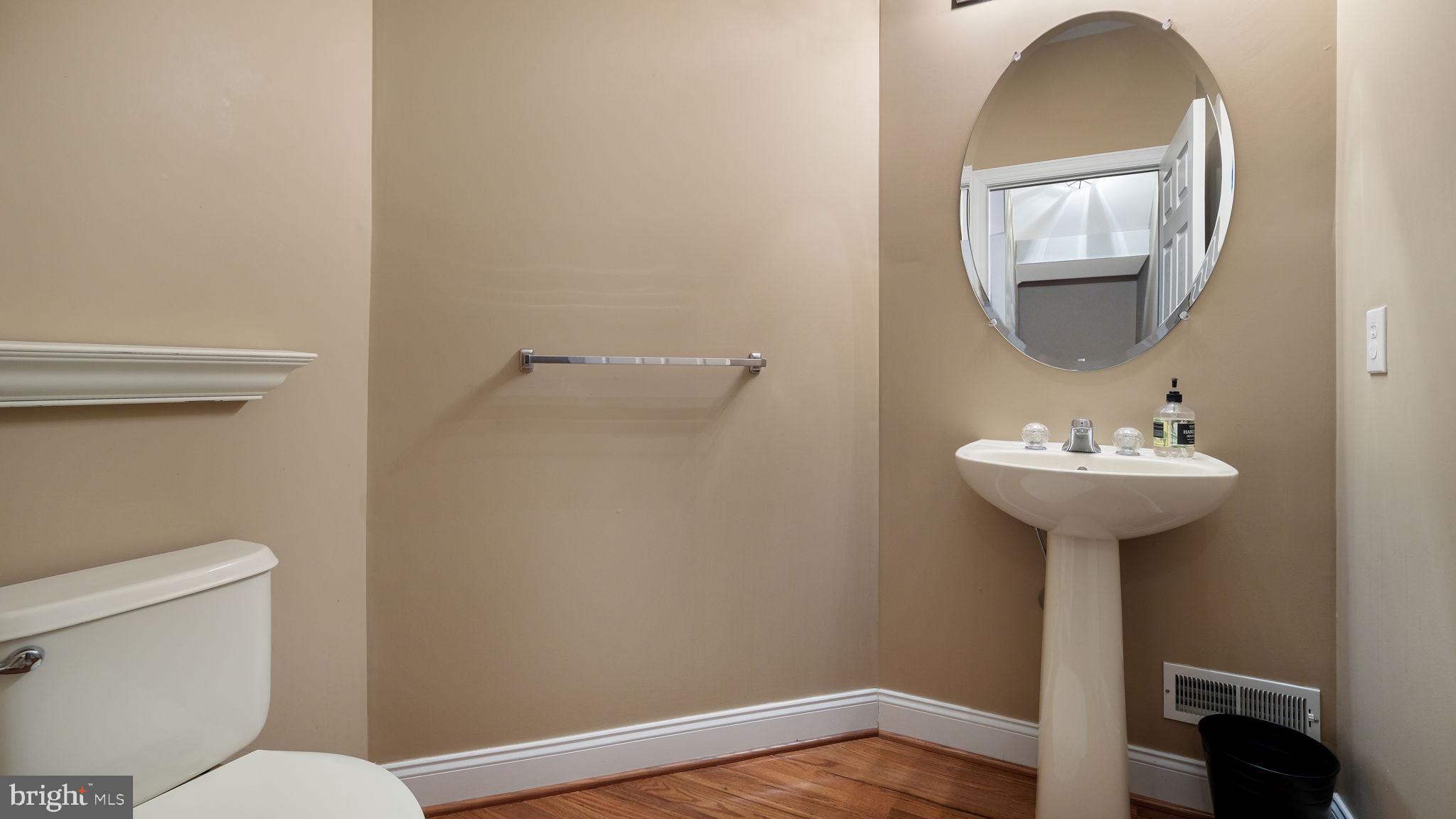 2372 Dorchester Street West, Unit W Furlong, PA 18925 - Photo 21 of 41 a bathroom with a toilet sink and mirror