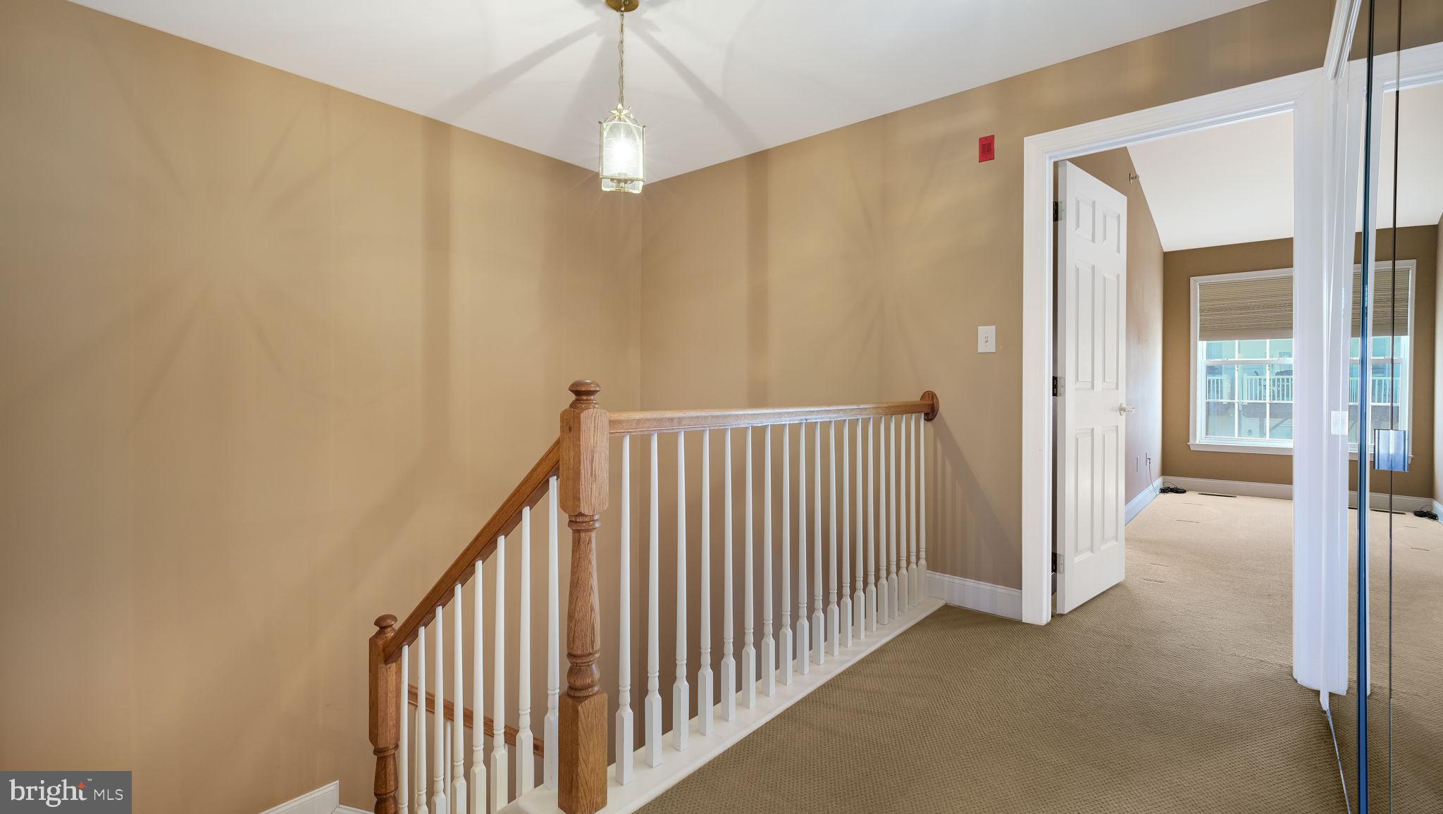 2372 Dorchester Street West, Unit W Furlong, PA 18925 - Photo 23 of 41 a view of a hallway with a chandelier