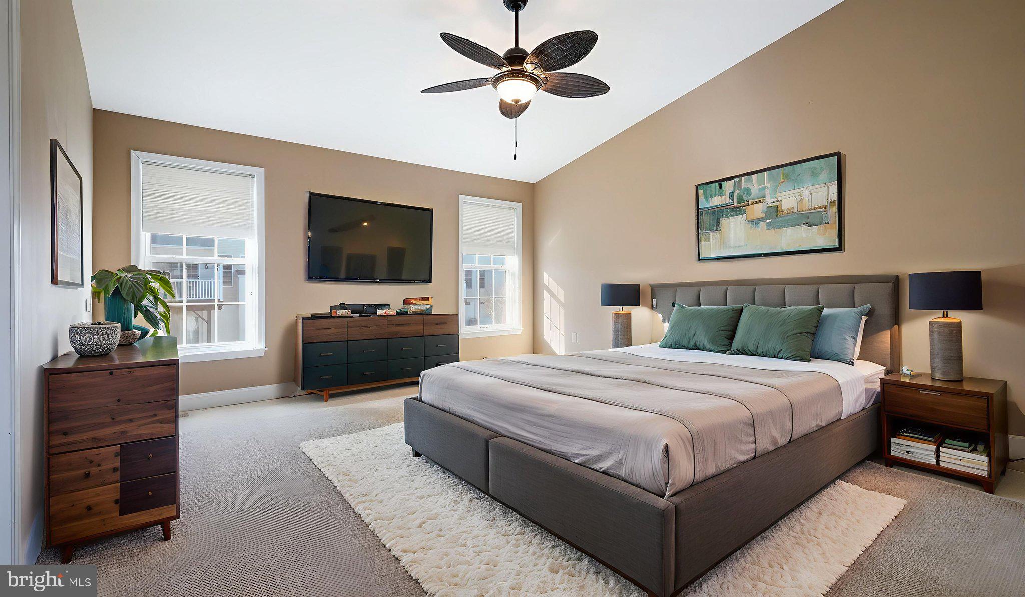 2372 Dorchester Street West, Unit W Furlong, PA 18925 - Photo 24 of 41 a spacious bedroom with a bed a couch and a flat screen tv