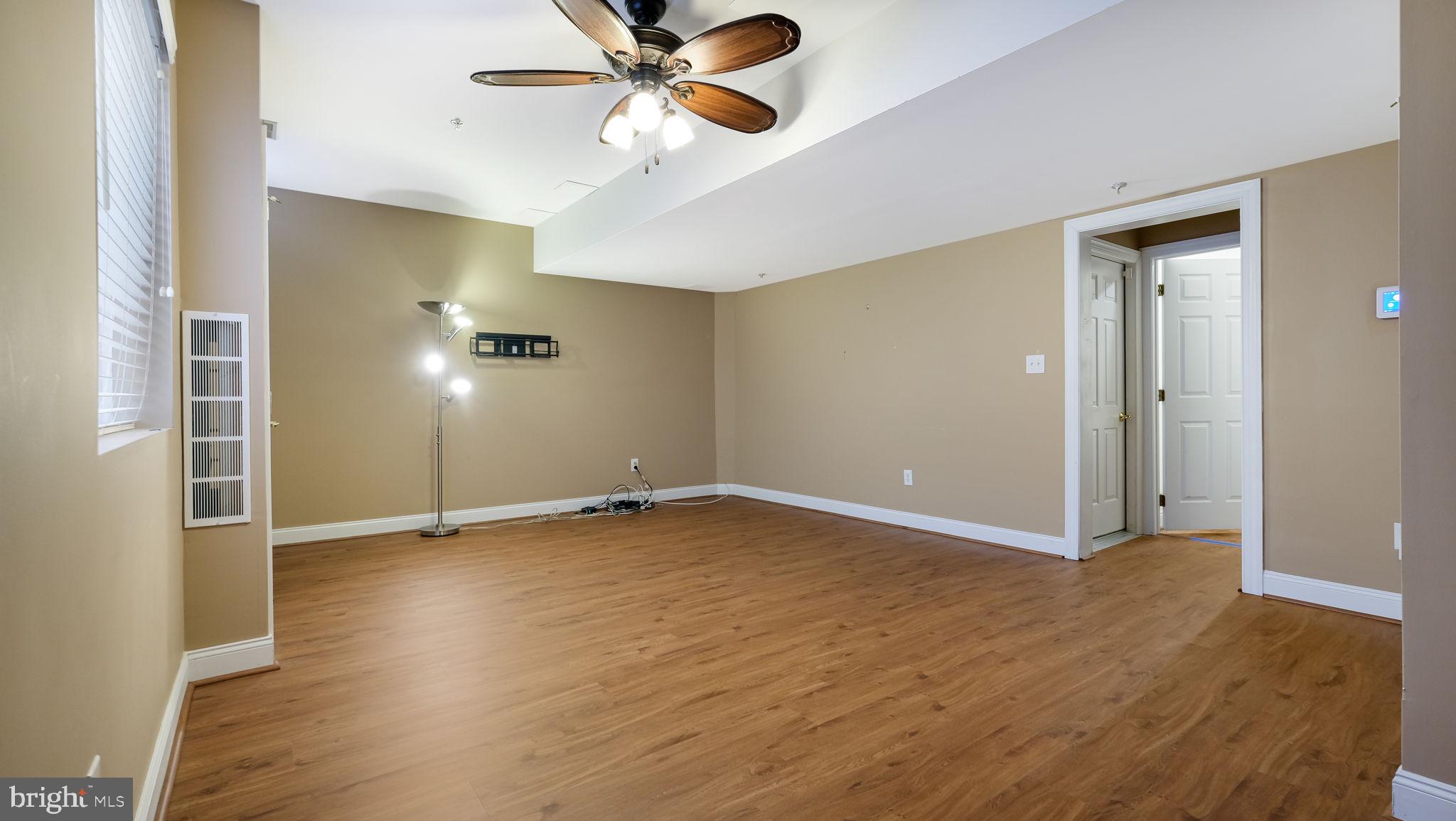2372 Dorchester Street West, Unit W Furlong, PA 18925 - Photo 36 of 41 wooden floor in an empty room with a window