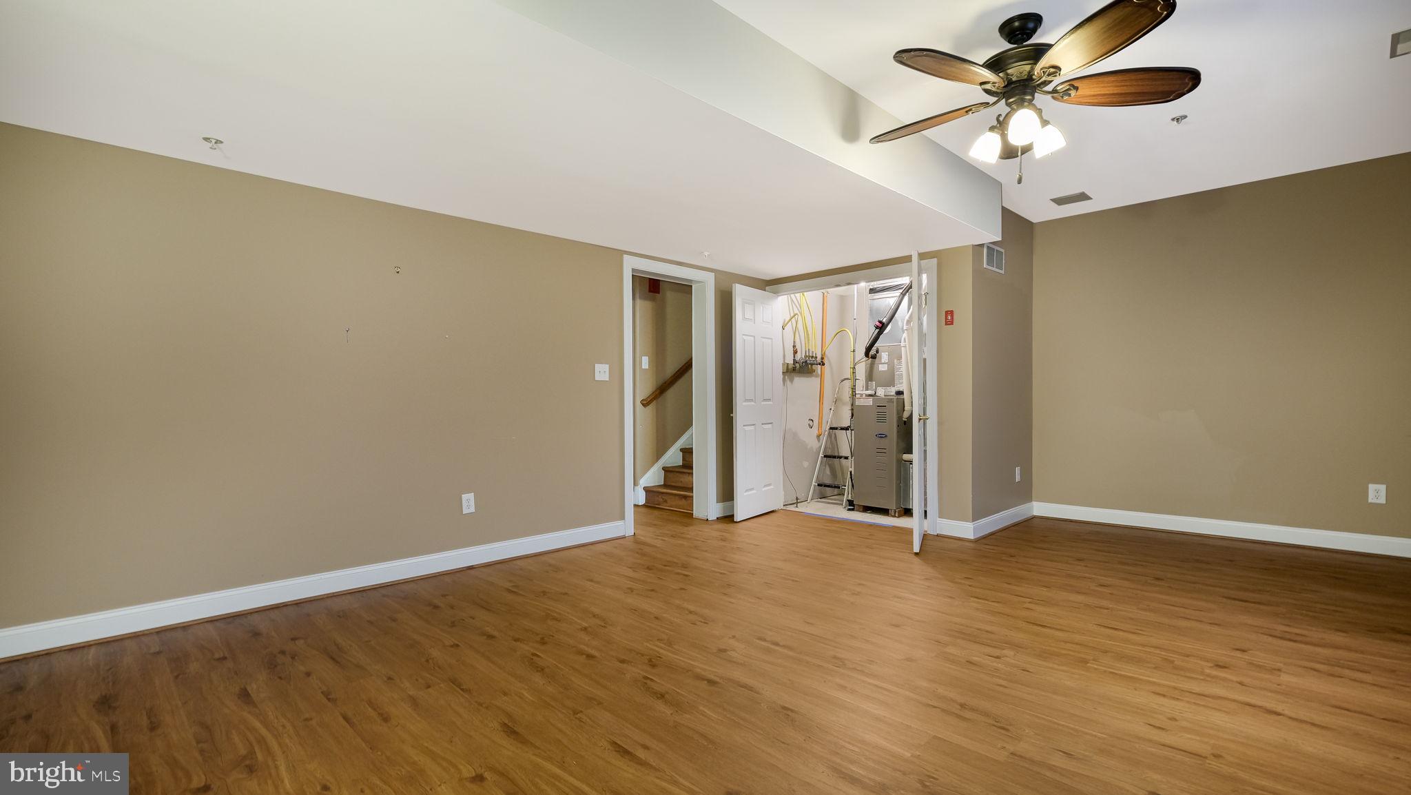 2372 Dorchester Street West, Unit W Furlong, PA 18925 - Photo 38 of 41 a view of an empty room with window and a ceiling fan