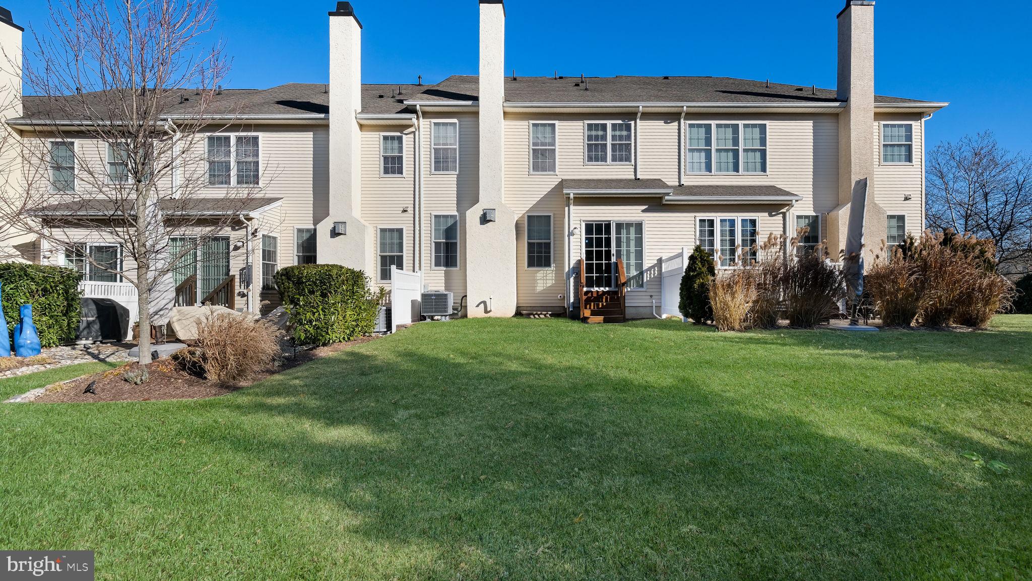 2372 Dorchester Street West, Unit W Furlong, PA 18925 - Photo 39 of 41 a view of a house with a yard and sitting area
