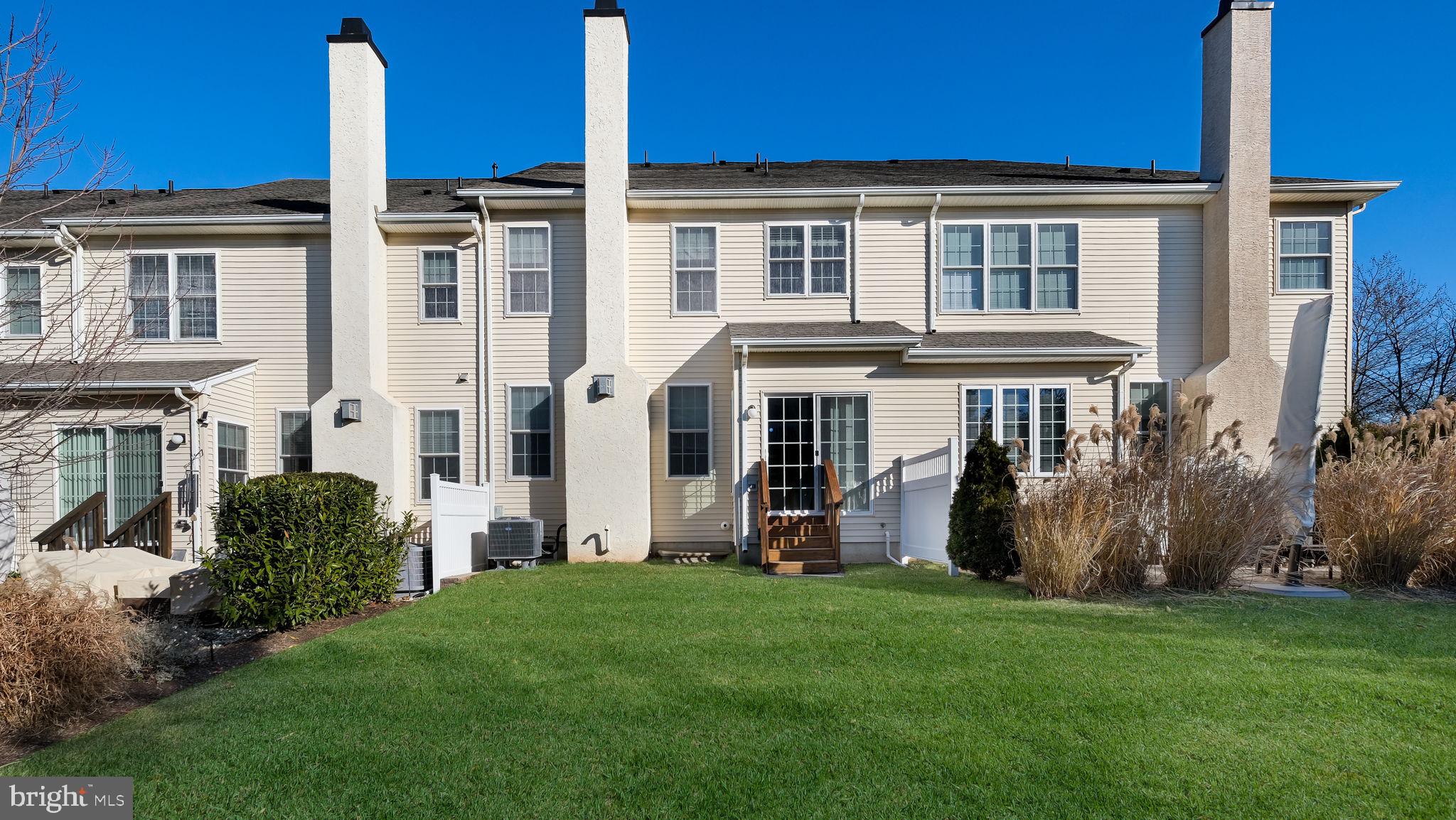 2372 Dorchester Street West, Unit W Furlong, PA 18925 - Photo 40 of 41 a view of a house with a yard and plants