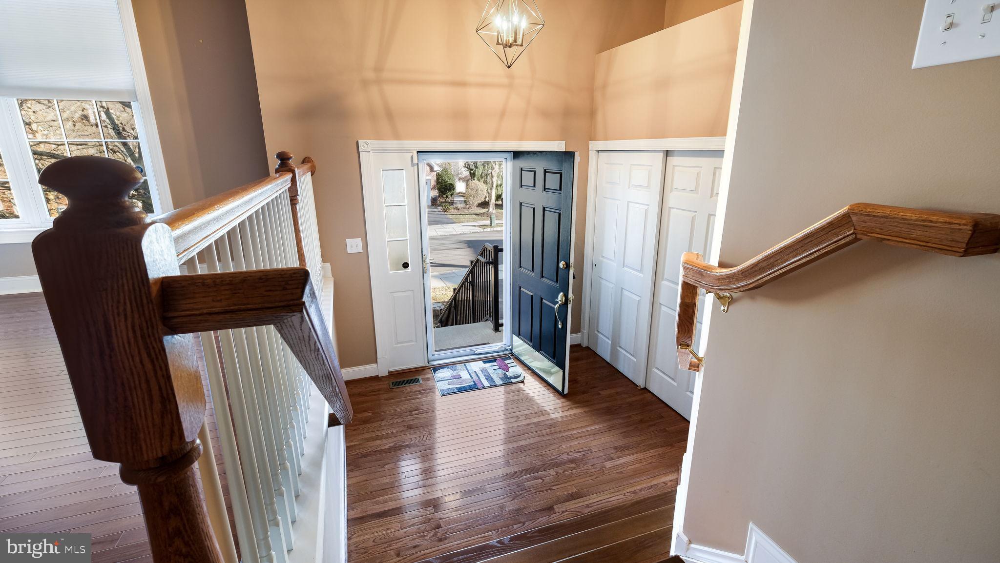 2372 Dorchester Street West, Unit W Furlong, PA 18925 - Photo 4 of 41 a view of hallway with wooden floor and stairs