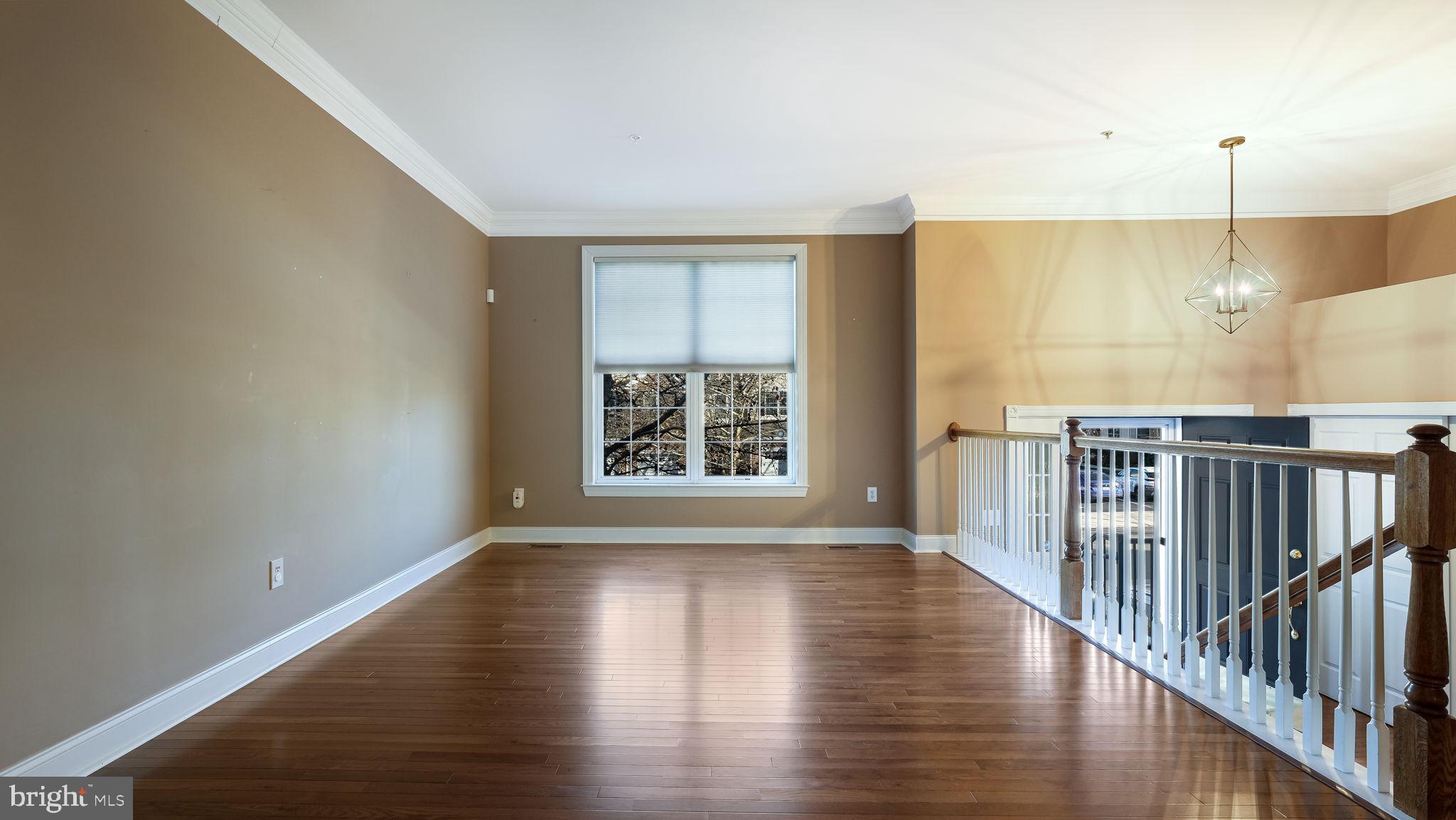 2372 Dorchester Street West, Unit W Furlong, PA 18925 - Photo 6 of 41 a view of an empty room with wooden floor and a window