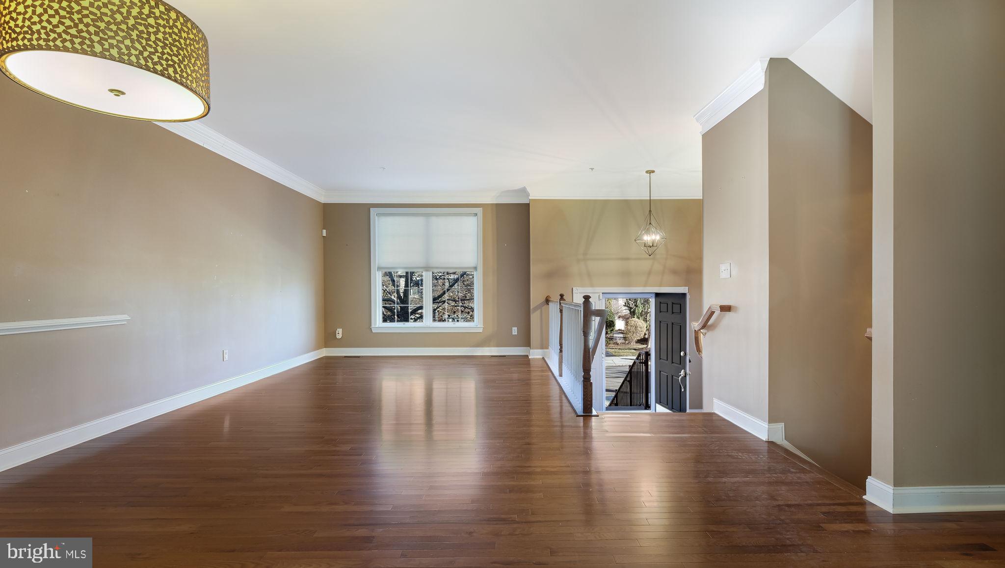 2372 Dorchester Street West, Unit W Furlong, PA 18925 - Photo 7 of 41 a view of a hallway with wooden floor and windows