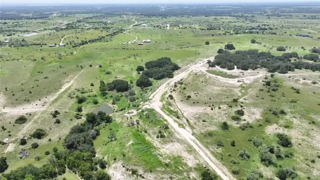 a view of a field with an trees