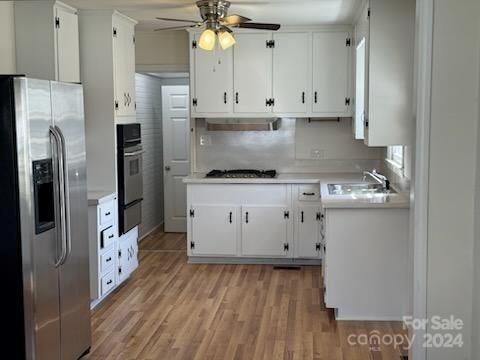 a view of cabinets and wooden floor