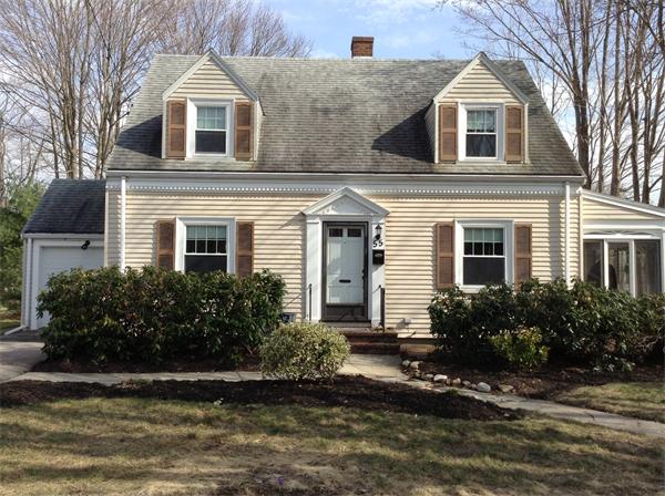 55 High Street Needham, MA 02494 - Photo 1 of 15 a front view of a house with a yard