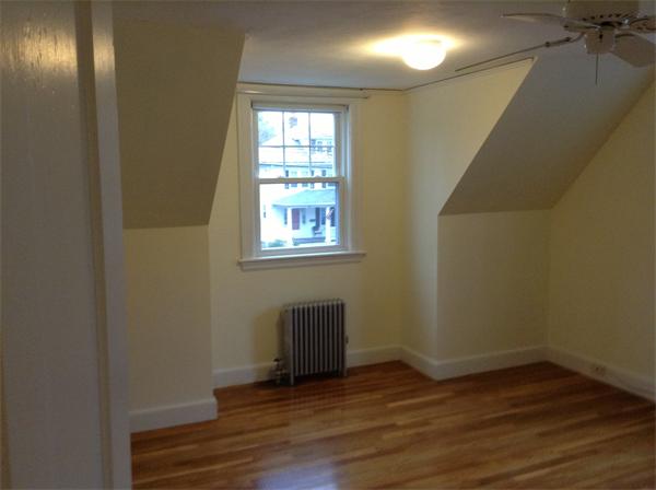55 High Street Needham, MA 02494 - Photo 11 of 15 an empty room with wooden floor and windows