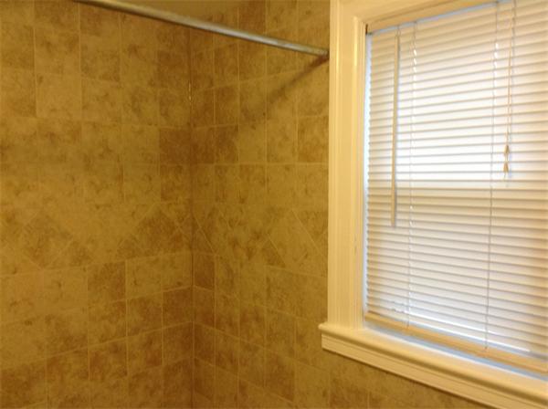 55 High Street Needham, MA 02494 - Photo 12 of 15 a bathroom with a window and a shower