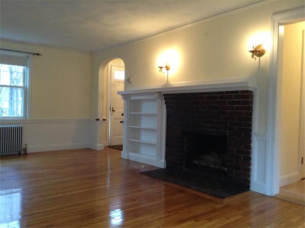 55 High Street Needham, MA 02494 - Photo 2 of 15 a view of empty room with wooden floor and fireplace