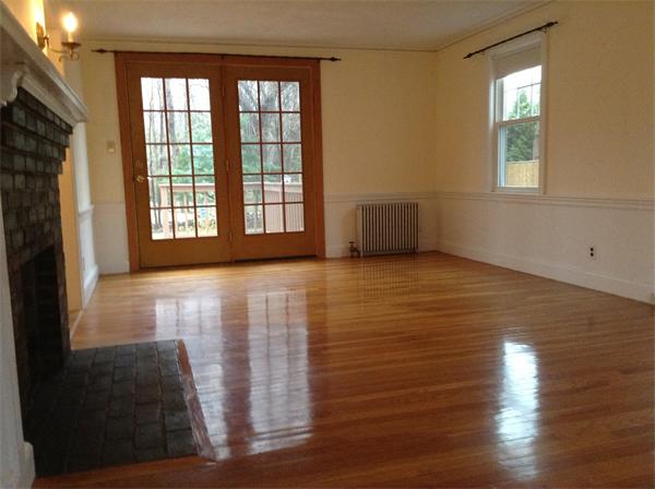 55 High Street Needham, MA 02494 - Photo 3 of 15 a view of an empty room with wooden floor and a window