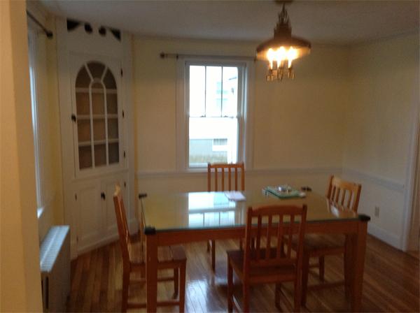 55 High Street Needham, MA 02494 - Photo 4 of 15 a view of a dining room with furniture and chandelier