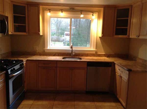 55 High Street Needham, MA 02494 - Photo 6 of 15 a kitchen with granite countertop a sink and a stove